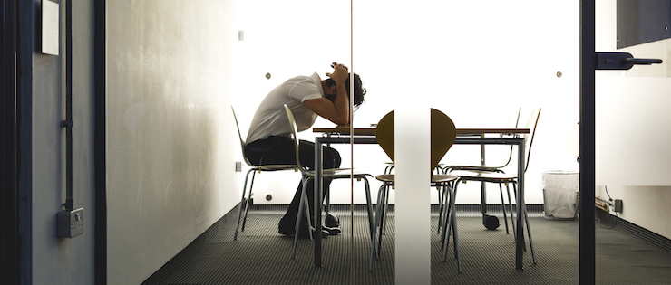 young man having a panic attack at work