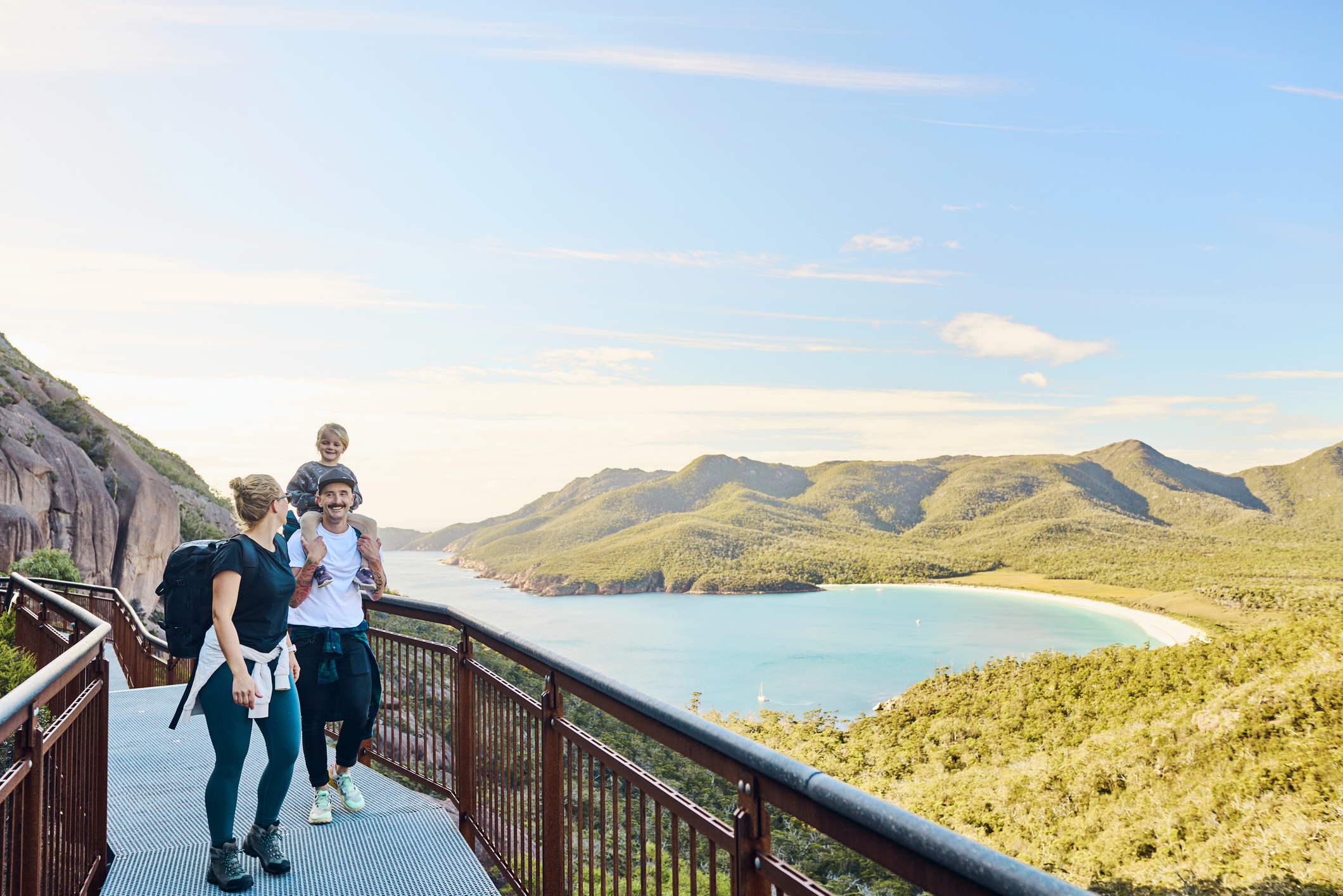 Family on walk next to Australian mountains